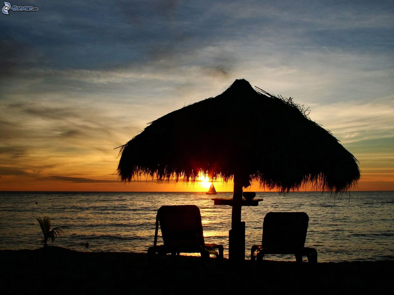 deck-chairs-on-the-beach,-sunset-behind-...153418.jpg