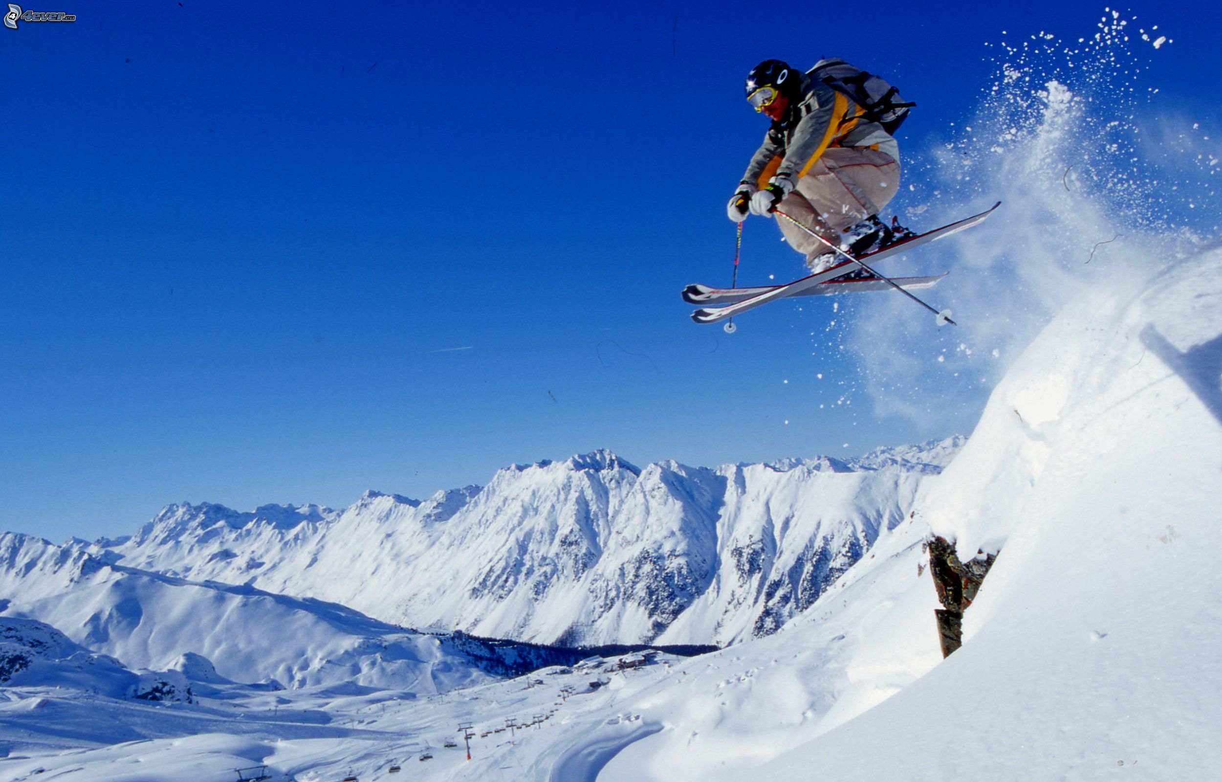 http://pictures.4ever.eu/data/download/sport/winter-sports/extreme-skiing,-jump,-snowy-mountains-219692.jpg?no-logo